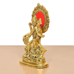 Saraswati Maa statue side profile, golden metal, red circular halo