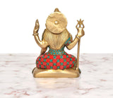 Rear view of Lord Shiva brass statue with trident, beaded multicolor dress