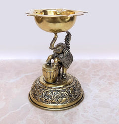 Brass elephant oil lamp with engraved pedestal and oil-carrying stand