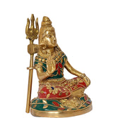 Brass Shiva murti angled view, green-blue and red floral patterns on attire, trident