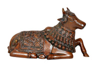 Brass Nandi bull statue lying down, detailed head and beaded armor on chest