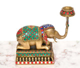 Brass elephant candle stand lamp from front-left angle with decorative forehead and trunk