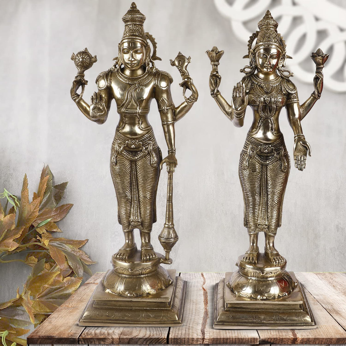 Brass Lakshmi and Vishnu standing idol pair with ornate headdresses on square bases
