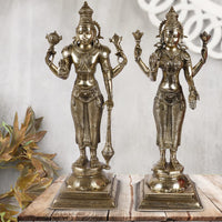 Brass Lakshmi and Vishnu standing idol pair with ornate headdresses on square bases