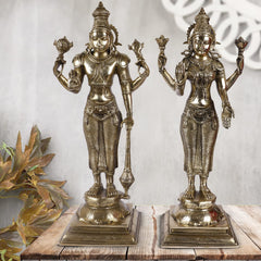 Brass Lakshmi and Vishnu standing idol pair with ornate headdresses on square bases