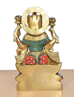Brass Lakshmi idol back view with arched halo disc and jeweled belt