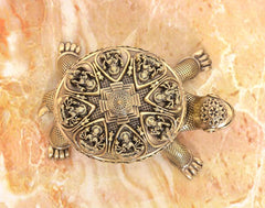 Bronze tortoise figurine closeup of engraved yantra lid with side motifs