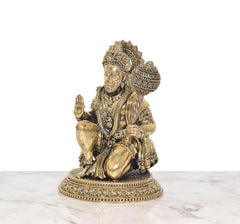 Hanuman JI brass sitting sculpture, side view with raised hand and drum-like mace