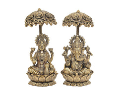 Brass Lakshmi and Ganesha statue pair, front view under decorative chatri