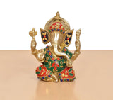 Brass Ganpati Bappa idol, gold tone with green, red, and blue jeweled ornaments