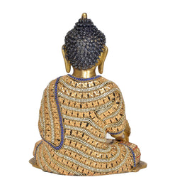Rear view brass Buddha statue, dark curly hair, blue collar, patterned beaded robe