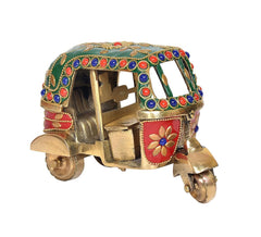 Brass tuk-tuk vehicle sculpture, side view with green canopy, red inset panels, beaded trim