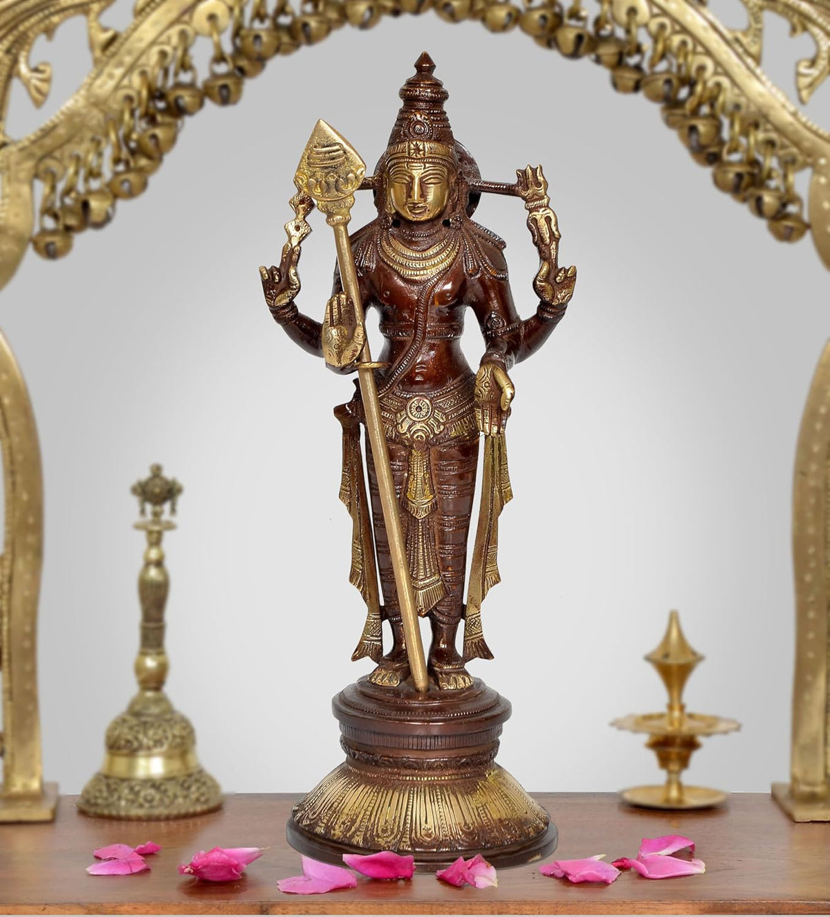 Brass standing Kartikeya Murugan murti, holding spear and trident-like staff