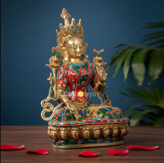 Seated Tara Devi brass deity statue with jeweled robe and decorative base, multicolor