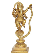 Brass Ganesha dancing idol with arched halo, raised hand, serpent tail on pedestal