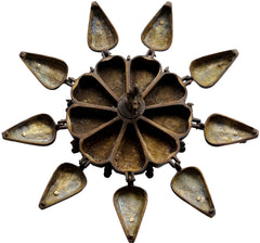 Brass peacock ritual box base: multiple teardrop panels with rivet dots, underside view