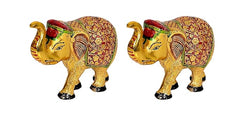 Side view pair of gold elephant idol figurines with red head accents and patterned panels