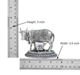 Brass cow with calf figurine; height 3 in and width 3.5 in shown