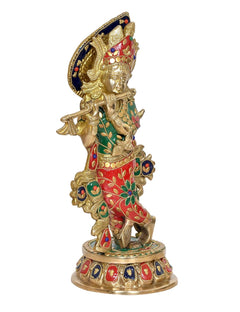 Brass Krishna playing flute idol statue, back-left view with blue halo and detailed red-green dress.