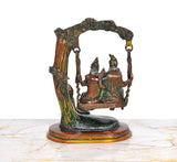 Brass Shiva Swings murti with Parvati and Ganesha, detailed canopy and base