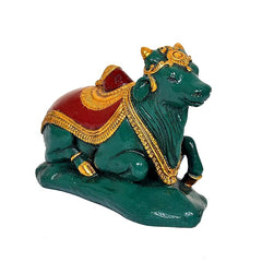 Nandi bull statue polyresin, front 3/4 view, red saddle and gold ornate trim