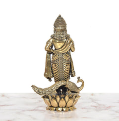 Back view of bronze Lord Kartikeya standing figurine on lotus with peacock and tail details