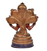 Back view of brass Patanjali idol with textured scaly coils and multi-armed cobra canopy