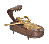 Brass Vishnu yoga nidra idol, side view with cobra hood and gold-toned body on base