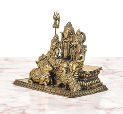 Shiv Parivar murti rear-side view with trident and devotees seated on engraved base