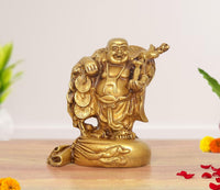 Brass laughing Buddha standing statue, happy face, holding coins, 6 inch