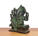 Brass Ganesha idol side view with Riddhi and Siddhi, ornate details on pedestal base