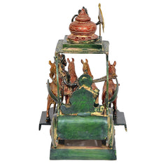 Brass chariot statue from behind with red finial lid and decorated platform.