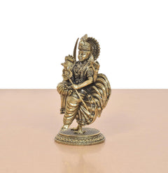 Bronze Bahuchara Mata idol side view, holding rooster with ornate robes on pedestal