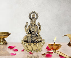 Brass Lakshmi idol statue with lotus base, seated with four arms, ornate crown
