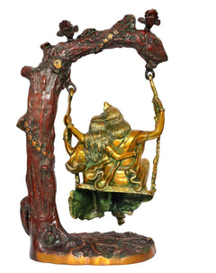 Brass Radha Krishna swing idol statue, rear view with hanging swing ropes