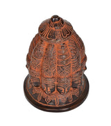 Brass Shiva nine-face stupa idol close-up, layered textures and front face features