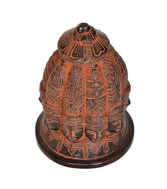 Brass Shiva nine-face stupa idol close-up, layered textures and front face features