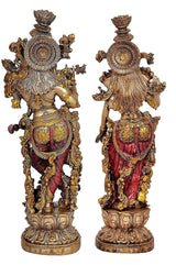 Radha Krishna resin statue pair, back views with ornate circular halo ornaments and draped garments