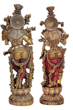 Radha Krishna resin statue pair, back views with ornate circular halo ornaments and draped garments