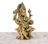 Lord Ganesha idol angled view, decorated jewelry and patterned legs on lotus base