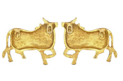 Brass cow pair wall hanging statues, back view with raised decorative motifs