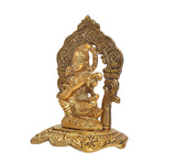 Saraswati Maa seated metal idol, gold tone, side view with ornate backrest and base