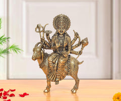 Brass MATA idol statue, seated on a goat with raised hands and ornate crown