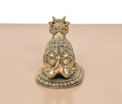 Brass seated Nandi statue rear view with crown and ornate lower base