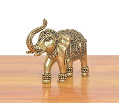 Brass elephant figurine, front view with ornate head details and curled trunk