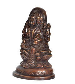 Brass Gayatri Mata statue, side view of seated goddess with raised hand gesture
