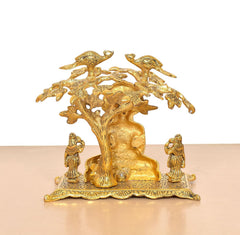 Mahavir Swami metal idol back view, ornate tree trunk with surrounding birds