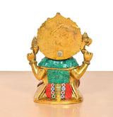Metal Ganesha idol from behind, gold back with teal skirt and red belt detail