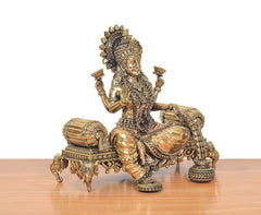 Lakshmi Maa idol three-quarter view, raised hands and ornate singhasan base