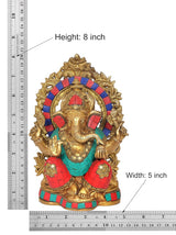Brass Ganesha idol with height 8 inch and width 5 inch markings, red-teal outfit